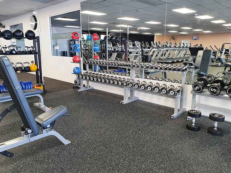 Rubber gym flooring in free weights areas of gym
