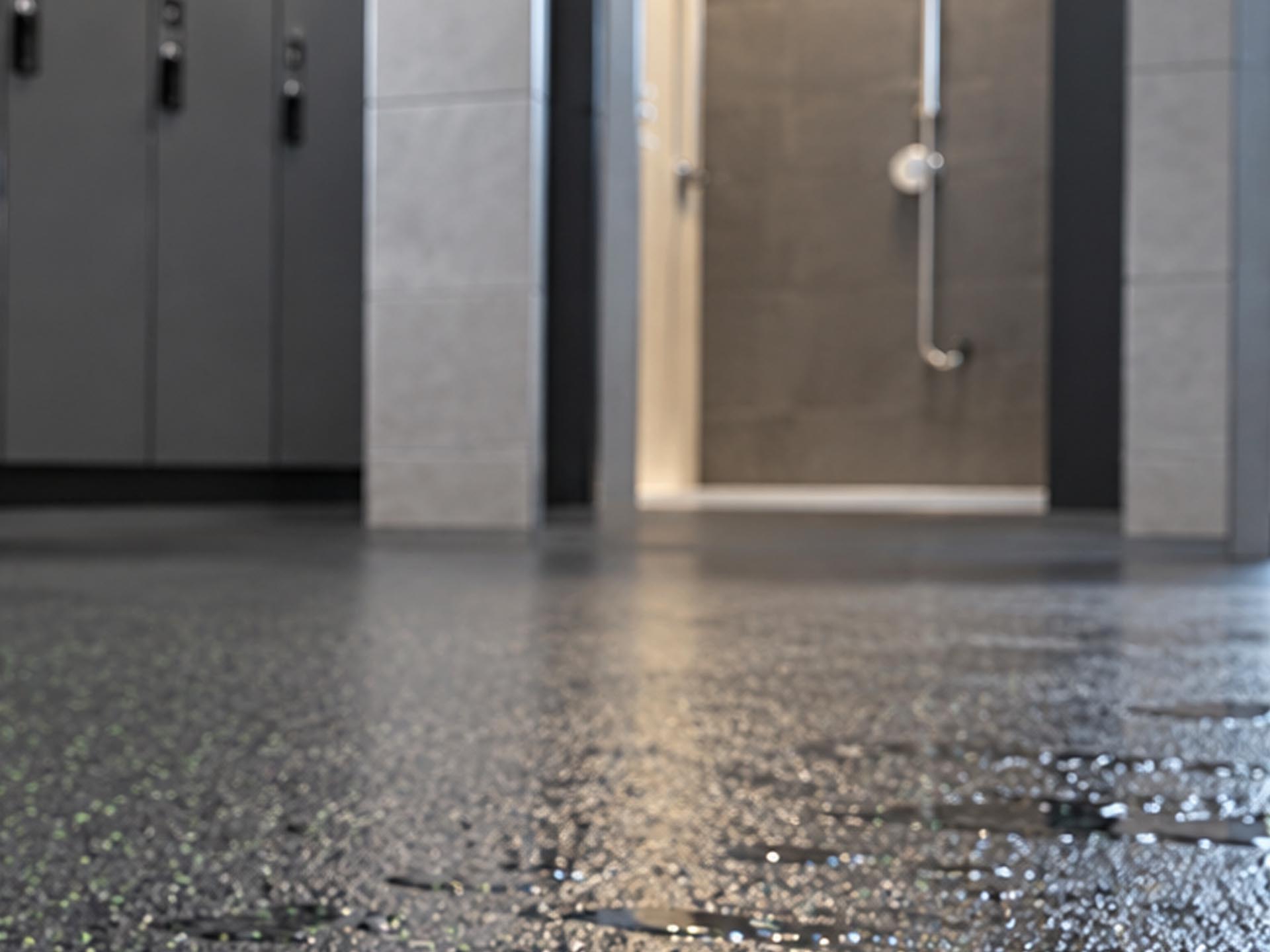 Wet rubber floor near shower area in change room